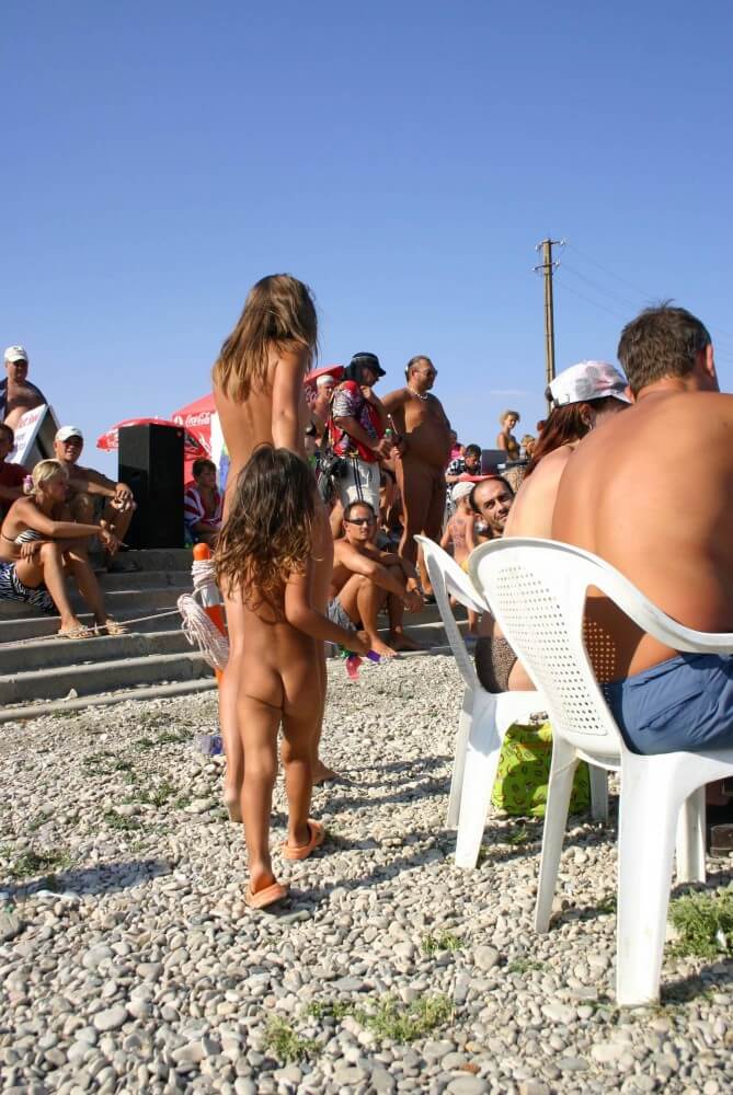 Naturist Standing Sideline - Naturism teaches us to accept and respect ourselves and others without inhibition