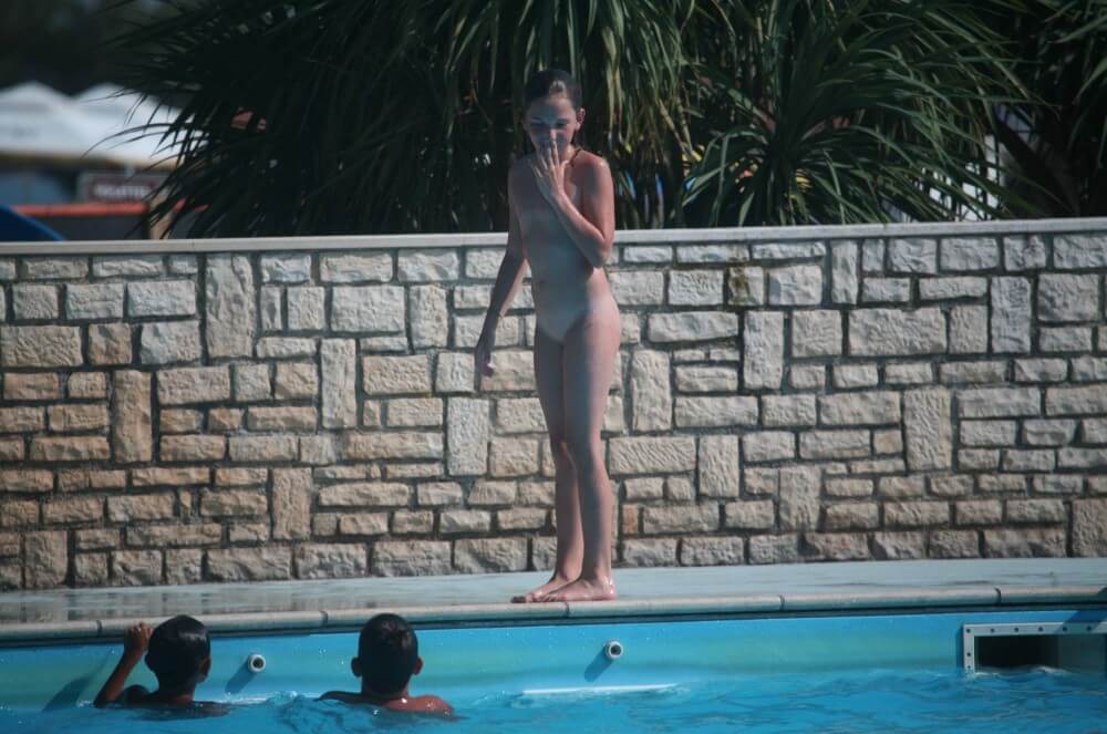 Naturist Pool-Side Singles photos - Nudity is perceived as a natural expression of life