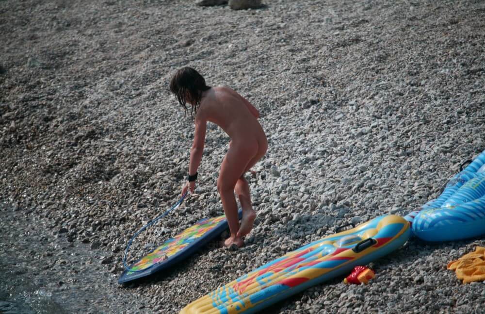 Naturist Surf Board Glides pics - Nudism knows no boundaries