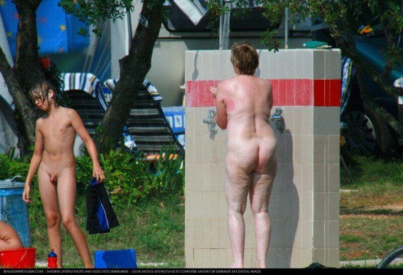 Covered in Towel Nudists-Boardwalk Biking - Naturism teaches respect for the beauty of the body and its natural forms