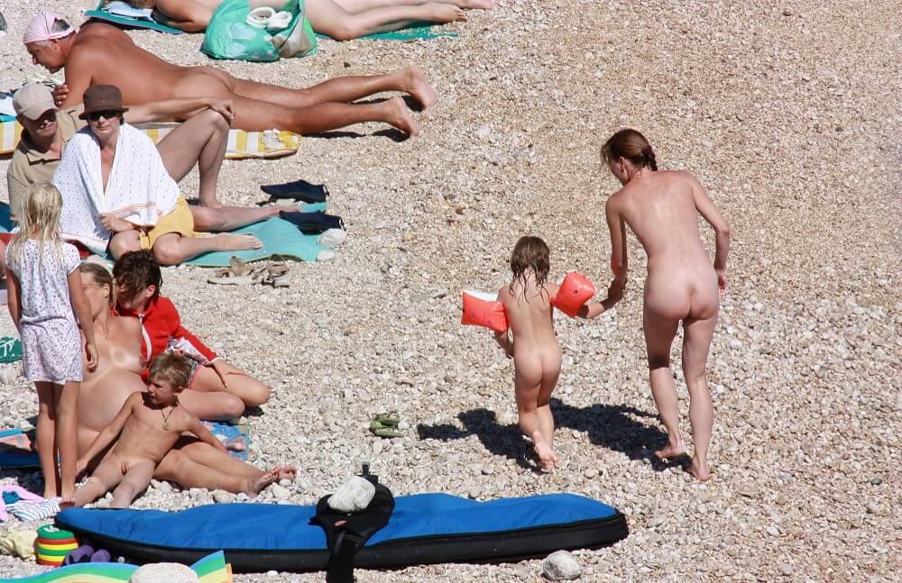 Orange Floaty Safety First Naturist pics - Nudism knows no boundaries